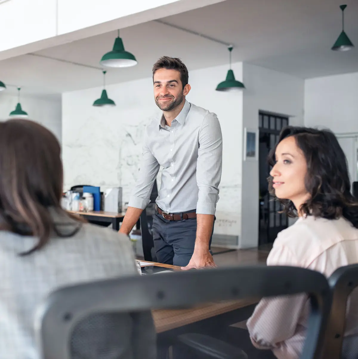 image of man standing in meeting