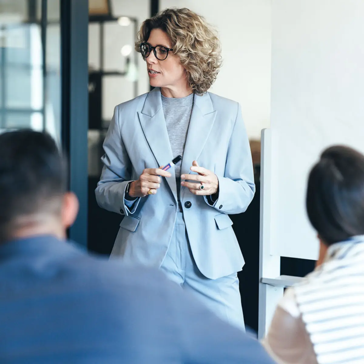 image of woman standing in meeting